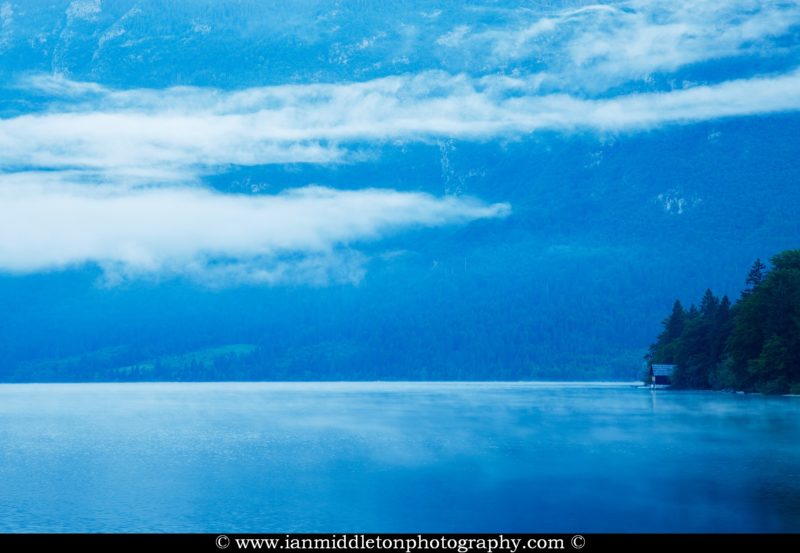 Morning mist and cloud over the Julian Alps at Lake Bohinj, Triglav National Park, Slovenia