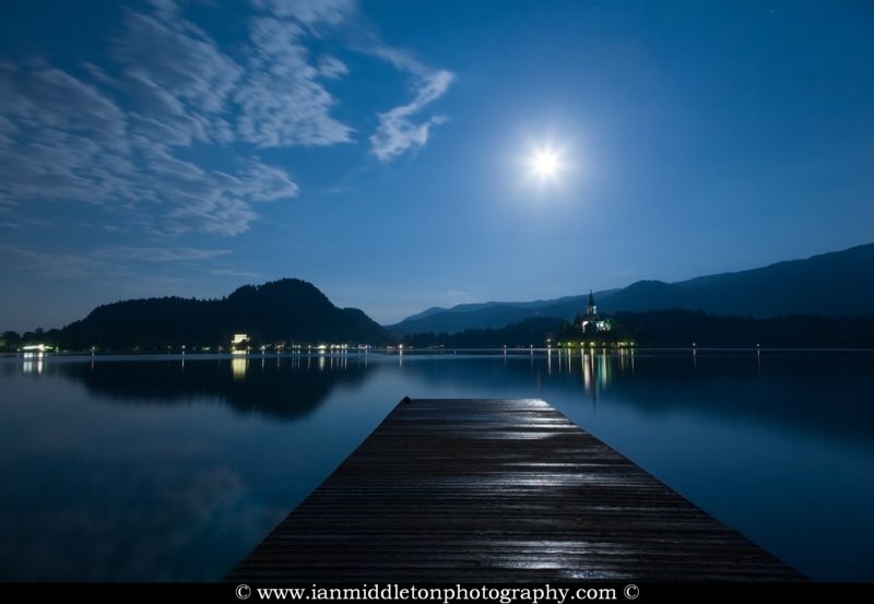Supermoon visible over the beautiful island church of the assumption of Mary, Lake Bled, Slovenia. Taken on the evening of Sunday June 23rd 2013 when the moon was full.
