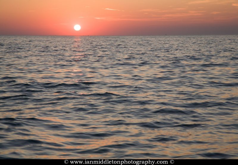 Sun setting over the Adriatic Sea, seen from Izola, Slovenia
