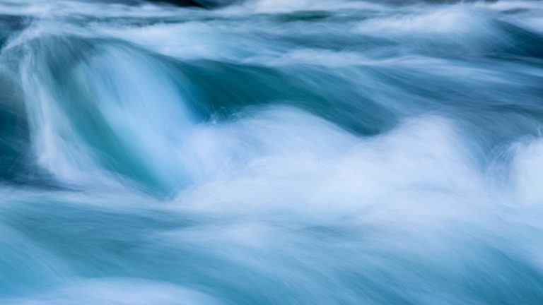 Water flowing around a rock on the Sava river on the northern outskirts of the capital city Ljubljana, Slovenia.