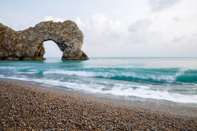 View of Durdle Door beach, Dorset, England. Durdle door is one of the many stunning locations to visit on the Jurassic coast in southern England. Dorset Photography Workshop