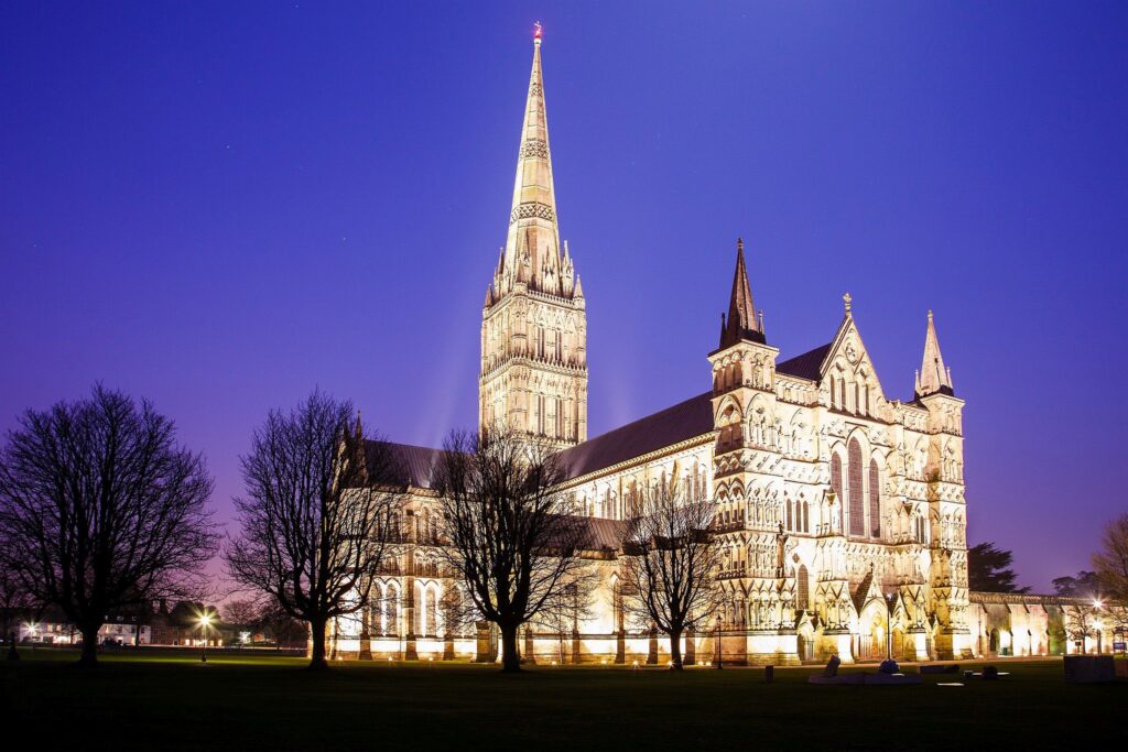 Salisbury cathedral on a moonlit evening, Wiltshire, England. Shot as the moon shone over the spire just after dusk.