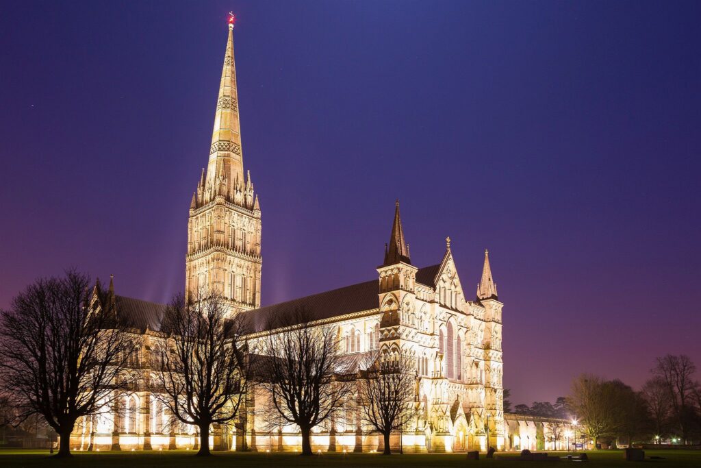 Salisbury cathedral on a moonlit evening, Wiltshire, England. Shot as the moon shone over the spire just after dusk.