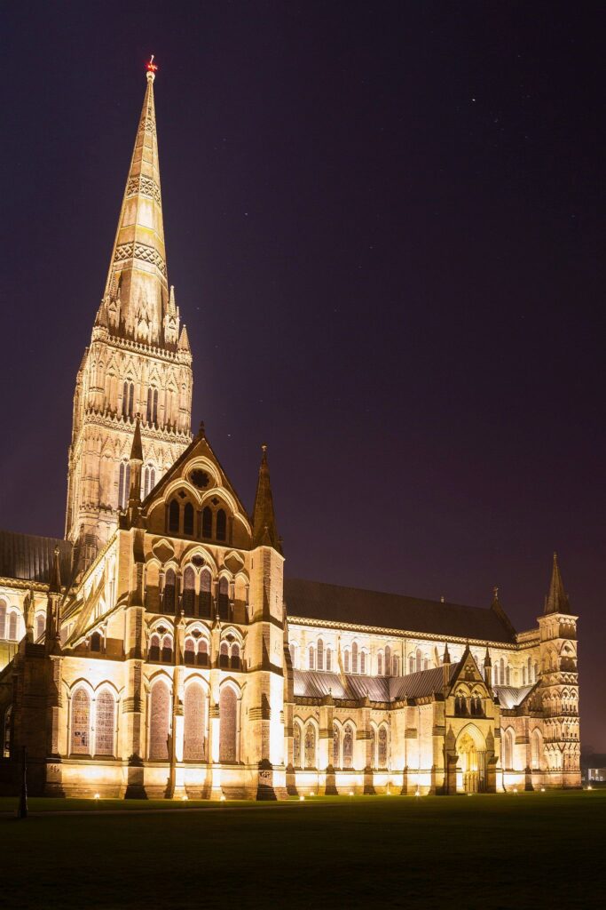 Salisbury cathedral on a moonlit evening, Wiltshire, England. Shot as the moon shone over the spire just after dusk.