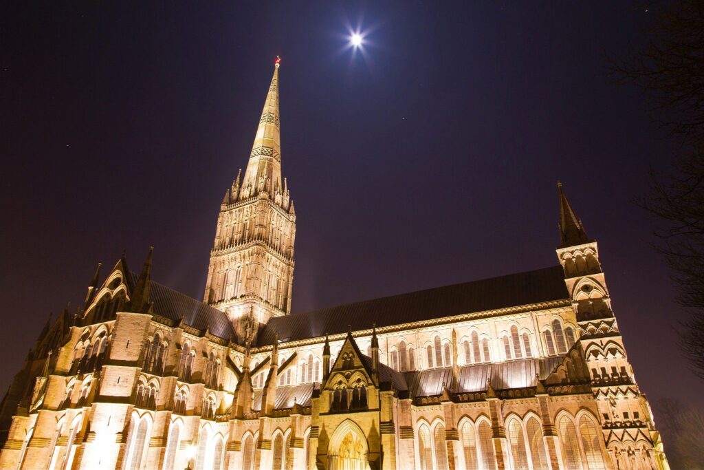 Salisbury cathedral on a moonlit evening, Wiltshire, England. Shot as the moon shone over the spire just after dusk.