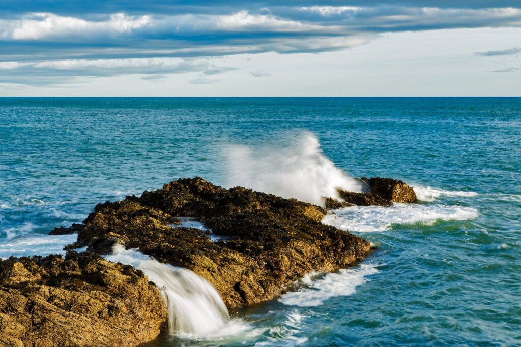 Waves crashing over rocks at Portlethen, near Aberdeen, Scotland.