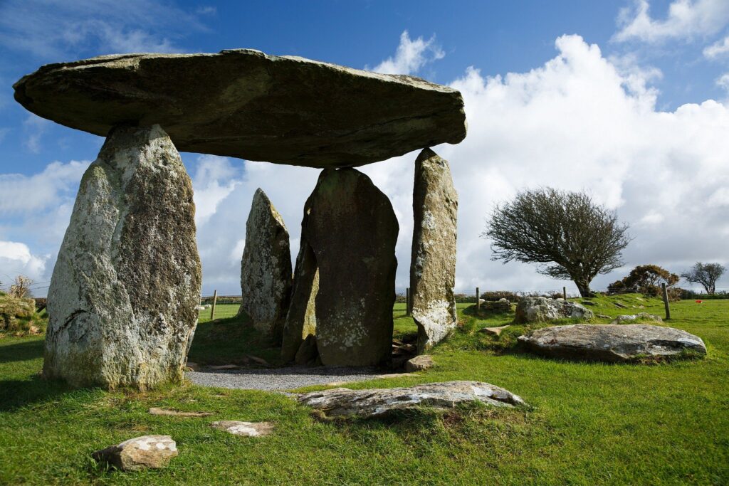 Pentre Ifan Neolithic Burial Chamber, Pembrokeshire, Wales. The Dolmen&#039;s huge capstone is delicately balanced on three uprights. Once known as Arthurs&#039; Quoit, Pentre Ifan means Ifan&#039;s Village. This monument, dating back to about 3500 BC and unusually oriented north-south, stands on the slopes of a ridge commanding extensive views over the Nevern Valley. The capstone weighs over 16 tons; it is 5m (16ft 6in) long and 2.4m (8ft) off the ground.