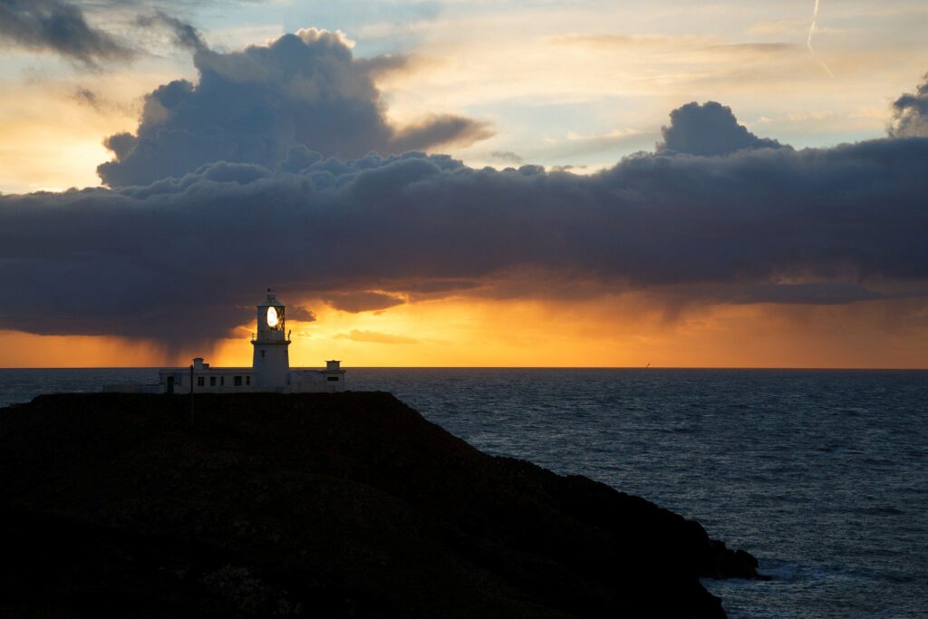 Lighthouse at Strumble Head at sunset, Pembrokeshire, Wales