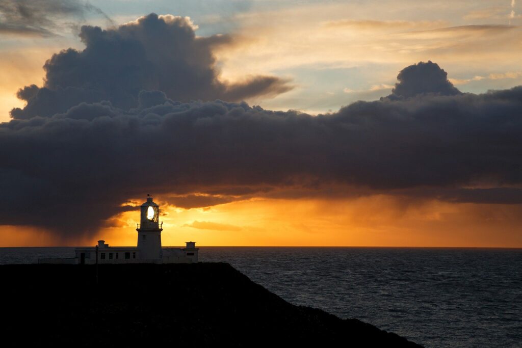 Lighthouse at Strumble Head at sunset, Pembrokeshire, Wales