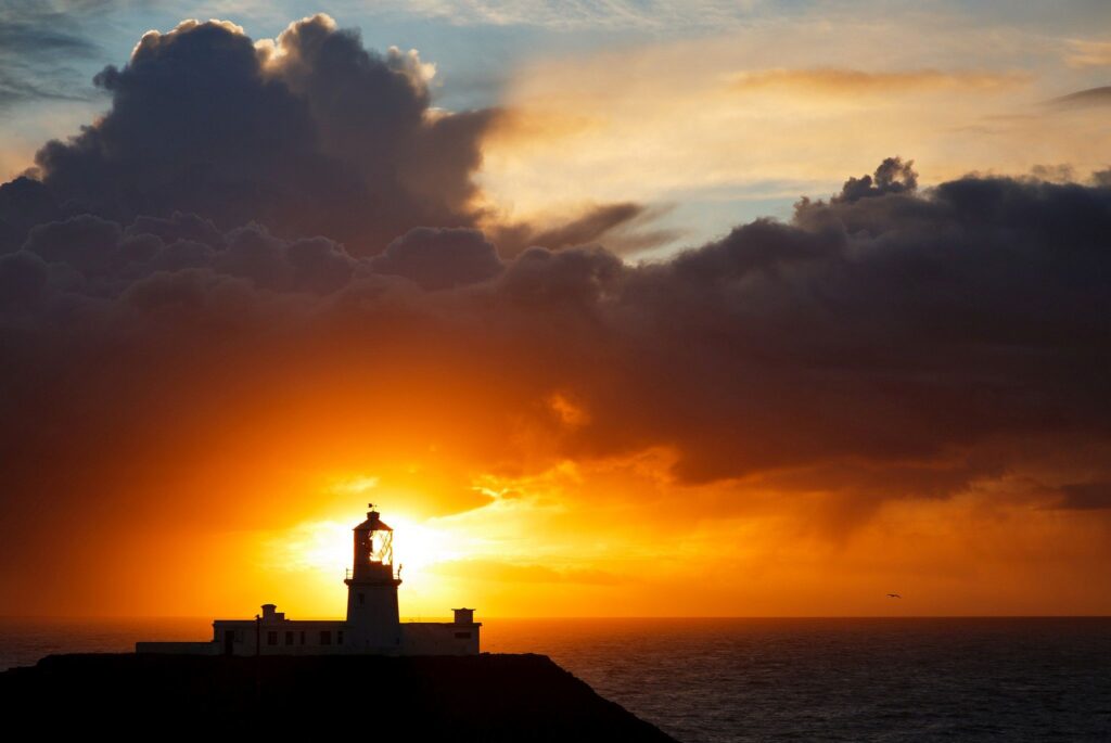 Lighthouse at Strumble Head at sunset, Pembrokeshire, Wales