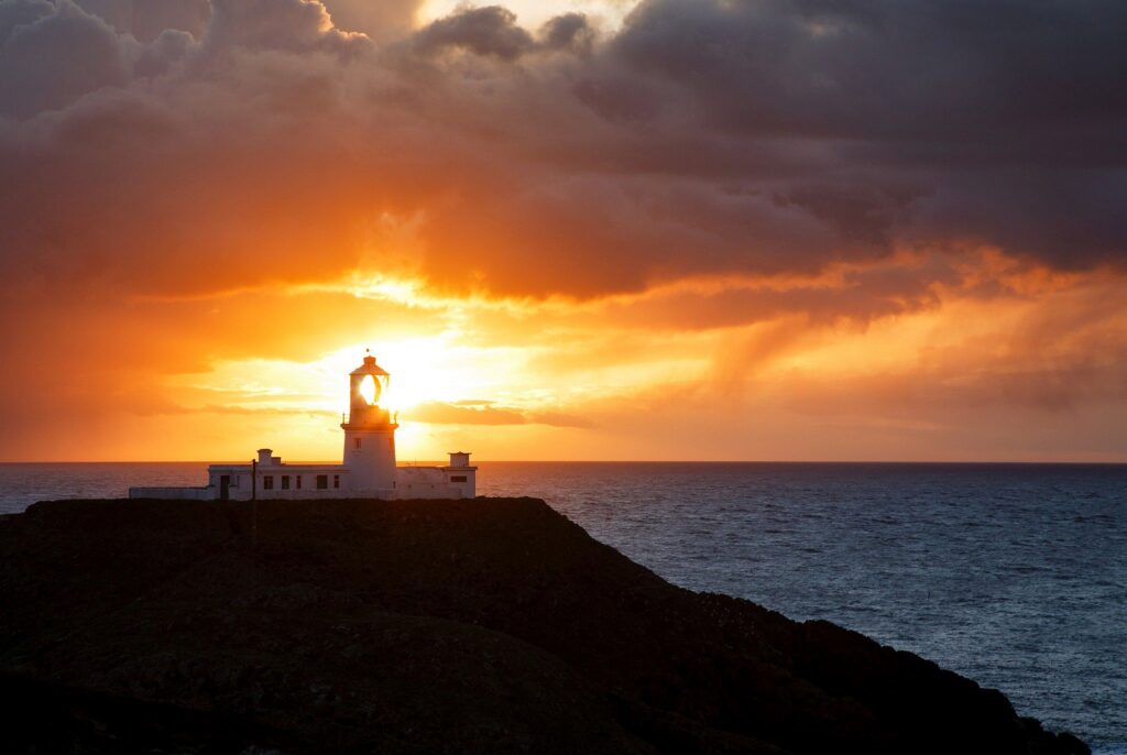 Lighthouse at Strumble Head at sunset, Pembrokeshire, Wales