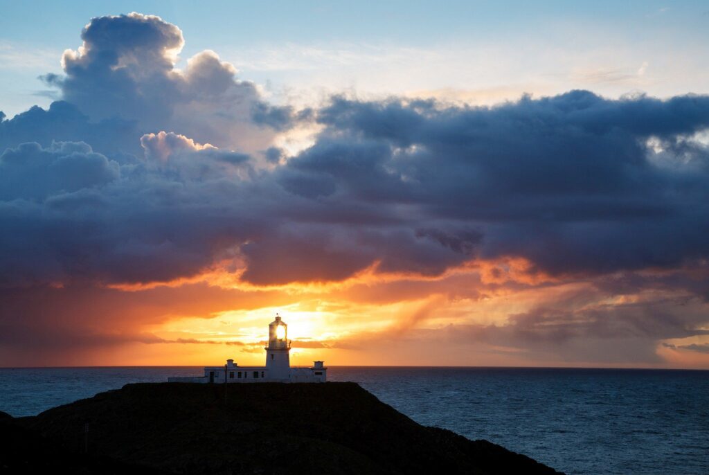 Lighthouse at Strumble Head at sunset, Pembrokeshire, Wales