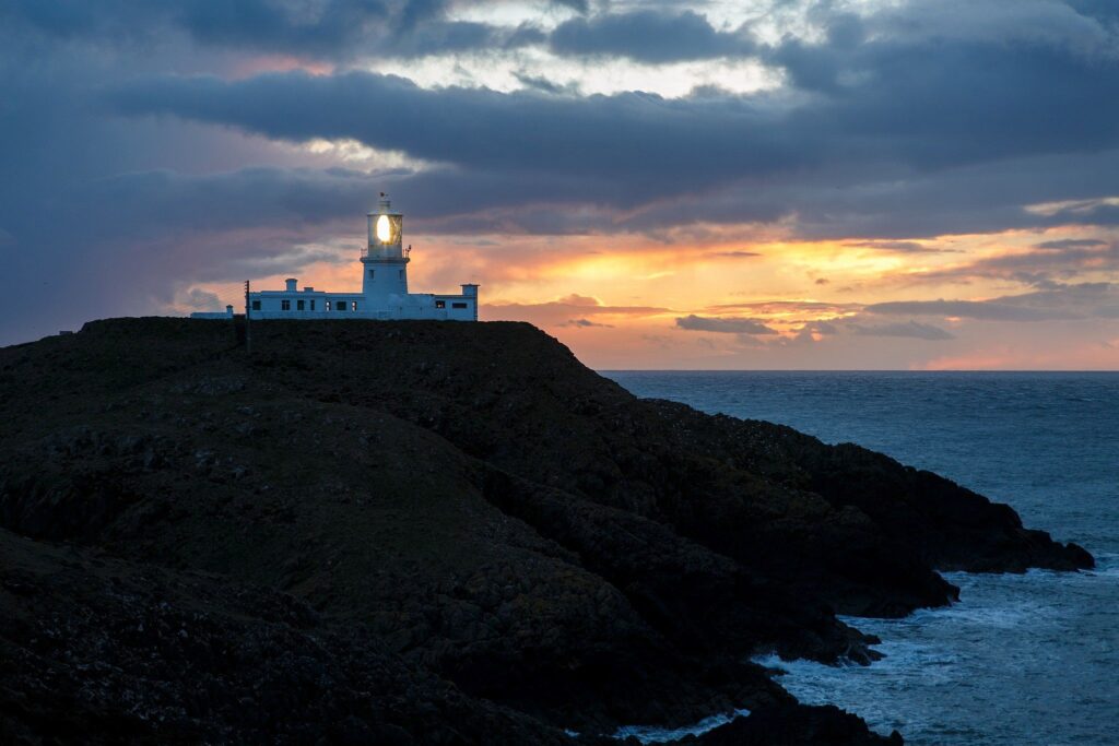 Lighthouse at Strumble Head at sunset, Pembrokeshire, Wales