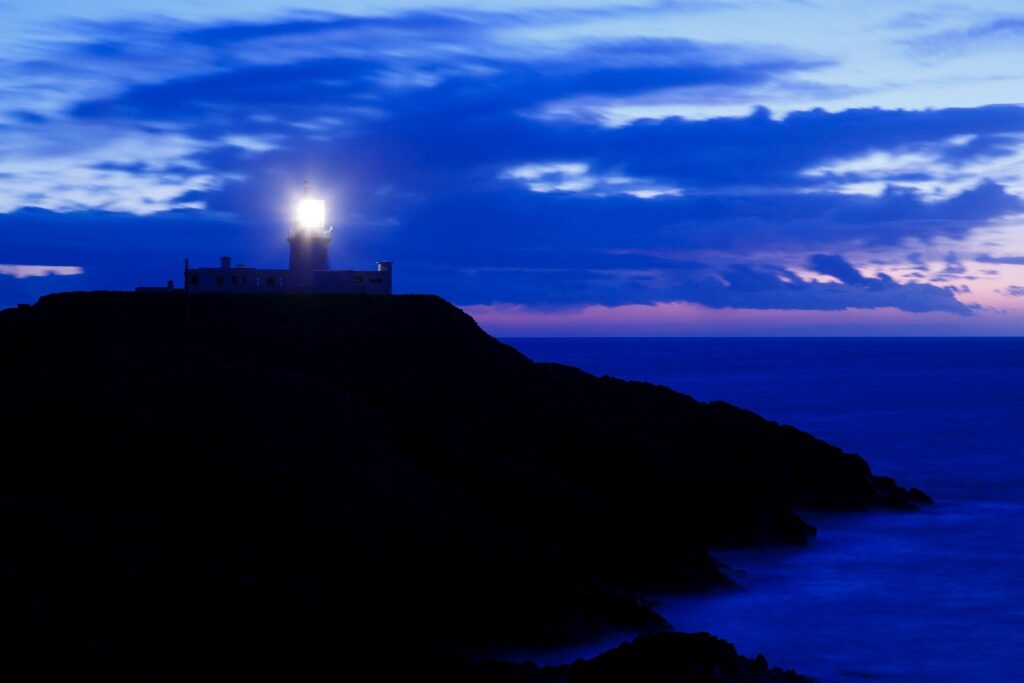 Lighthouse at Strumble Head at dusk, Pembrokeshire, Wales