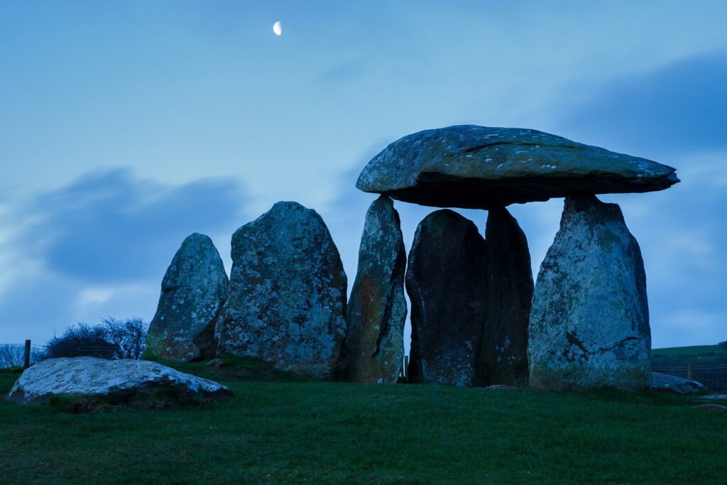 Pentre Ifan Neolithic Burial Chamber, Pembrokeshire, Wales. The Dolmen&#039;s huge capstone is delicately balanced on three uprights. Once known as Arthurs&#039; Quoit, Pentre Ifan means Ifan&#039;s Village. This monument, dating back to about 3500 BC and unusually oriented north-south, stands on the slopes of a ridge commanding extensive views over the Nevern Valley. The capstone weighs over 16 tons; it is 5m (16ft 6in) long and 2.4m (8ft) off the ground.