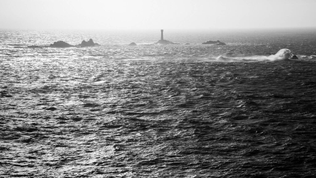 Longships Lighthouse at Lands End, photographed at sundown. Built on the Longships rocks in 1875 at the far southwestern tip of the British Isles, a notoriously deadly section of ocean.