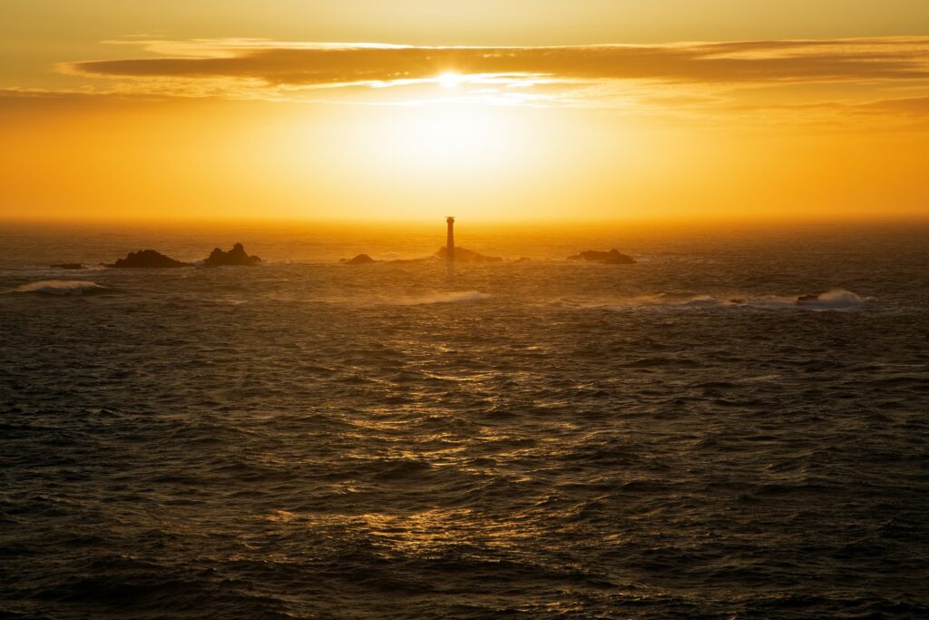 Longships Lighthouse at Lands End, photographed at sunset. Built on the Longships rocks in 1875 at the far southwestern tip of the British Isles, a notoriously deadly section of ocean.