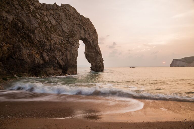 Durdle Door beach as the sun disappears for the day, Dorset, England. Durdle door is one of the many stunning locations to visit on the Jurassic coast in southern England.