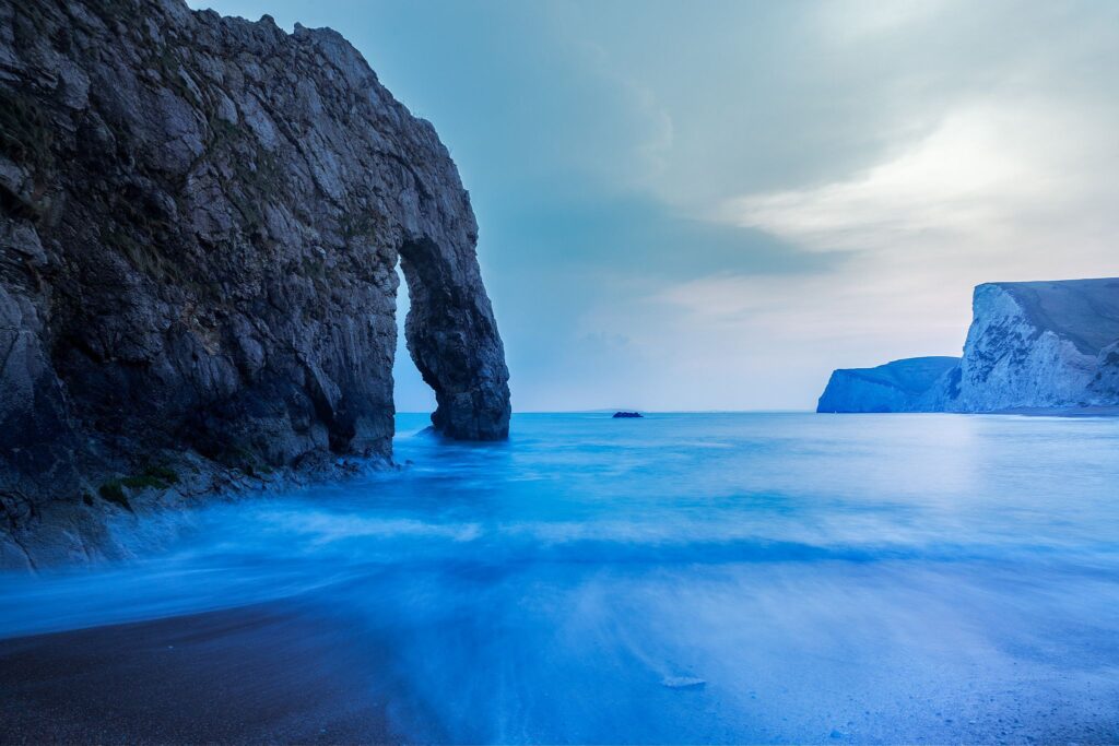 Evening view of Durdle Door beach, Dorset, England. Durdle door is one of the many stunning locations to visit on the Jurassic coast in southern England.