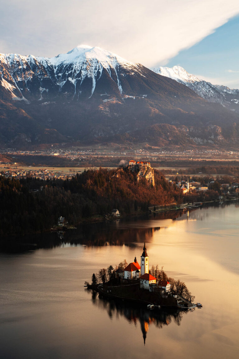 Morning view across Lake Bled to the island church and clifftop castle from Mala Osojnica, Slovenia.