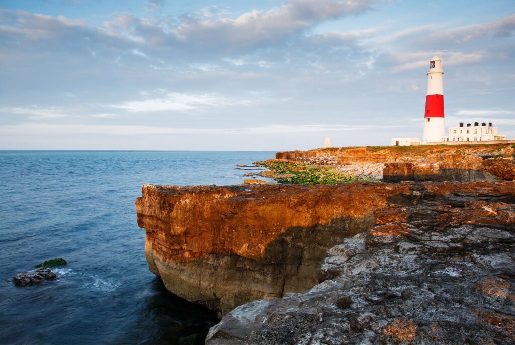 Lighthouse at Portland Bill in the early morning sun, near Weymouth, Jurassic Coast, Dorset, England.