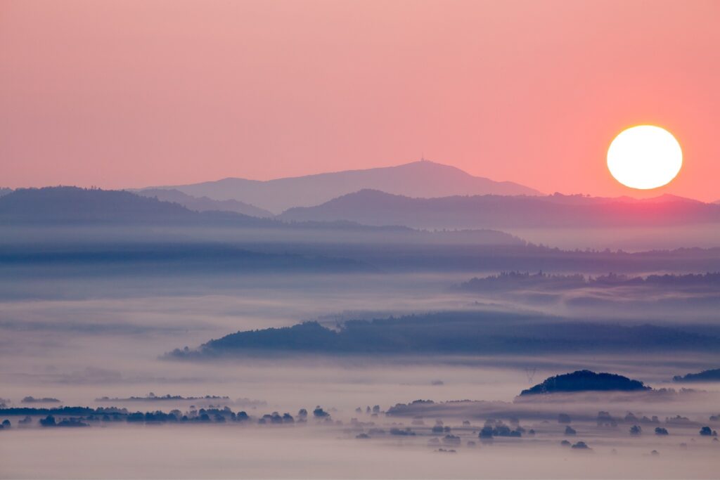 sunrise over the mist on the Ljubljana Moors (Ljubljansko Barje), a large area of wetland 160 square kilometres in size.