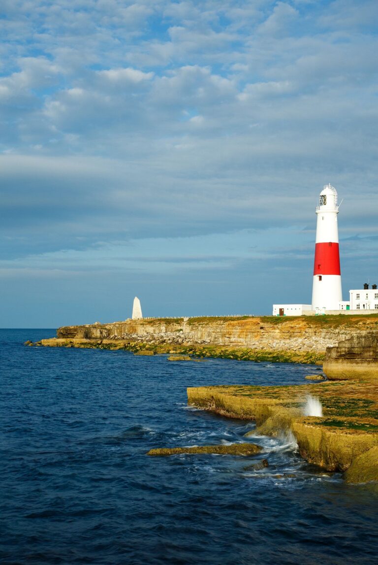 Lighthouse at Portland Bill in the early morning sun, near Weymouth, Jurassic Coast, Dorset, England.