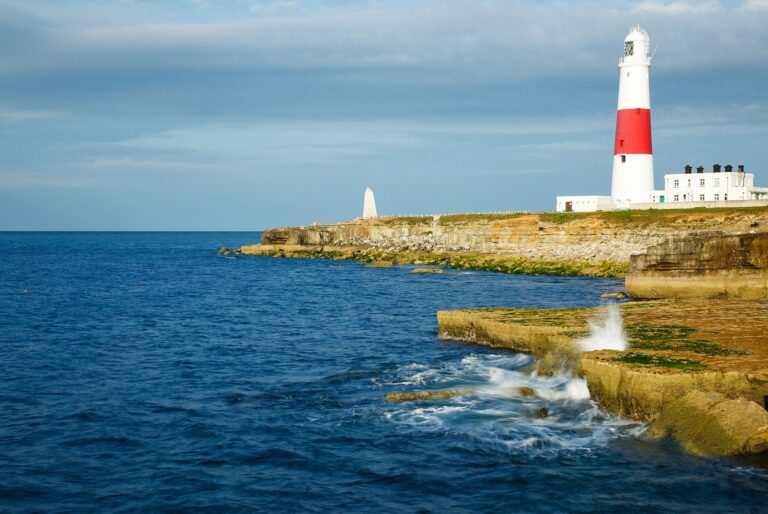 Lighthouse at Portland Bill in the early morning sun, near Weymouth, Jurassic Coast, Dorset, England.