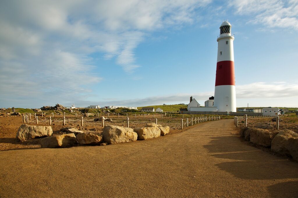 Lighthouse at Portland Bill in the early morning sun, near Weymouth, Jurassic Coast, Dorset, England.