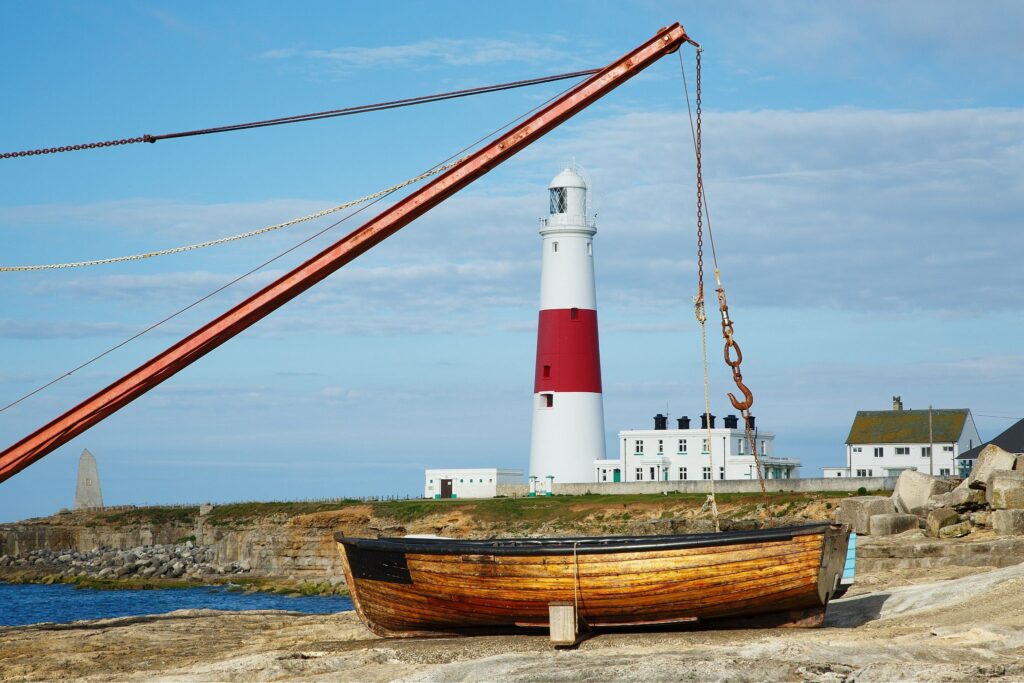 A different view of Portland Bill lighthouse through the old boat winch, near Weymouth, Jurassic Coast, Dorset, England.