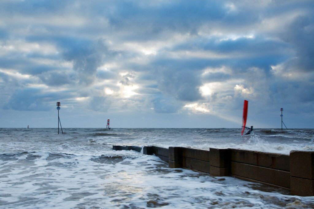 Windsurfing at Hunstanton beach, West Norfolk, England.