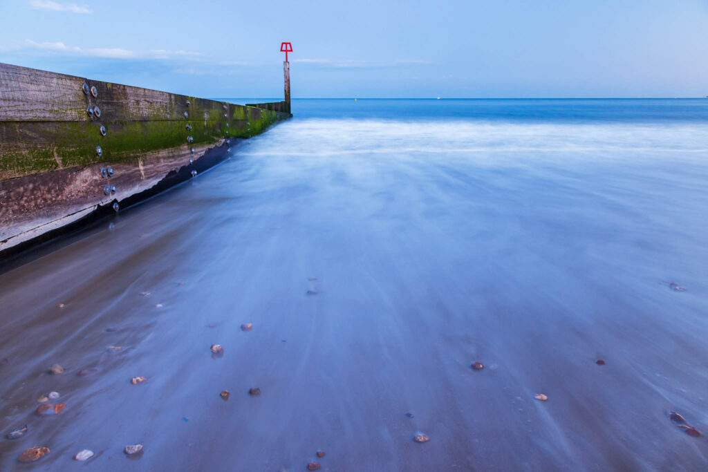 Bournemouth beach and groyne at dusk, Dorset, England