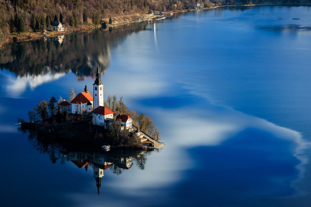 View across Lake Bled to the island church from Mala Osojnica, Slovenia.