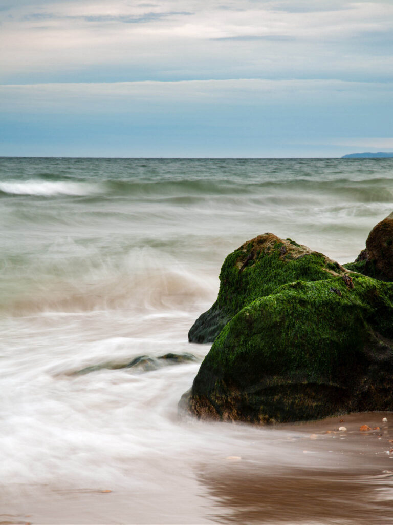 The beautiful coastal landscape at Highcliffe Beach in Dorset.