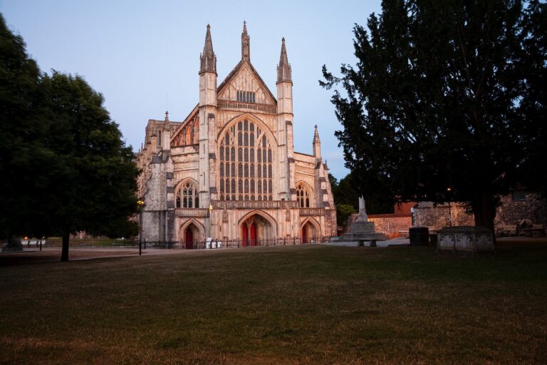 Winchester Cathedral at dusk, Hampshire, England. Winchester is the ancient capital of England.