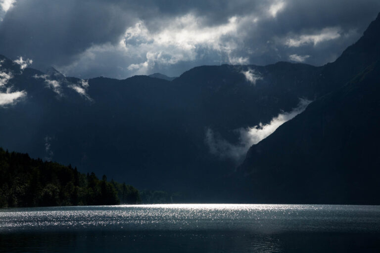 Beautiful light and clouds scattering over Bohinj Lake after a massive storm blew over the Bohinj valley, Triglav National Park, Slovenia.