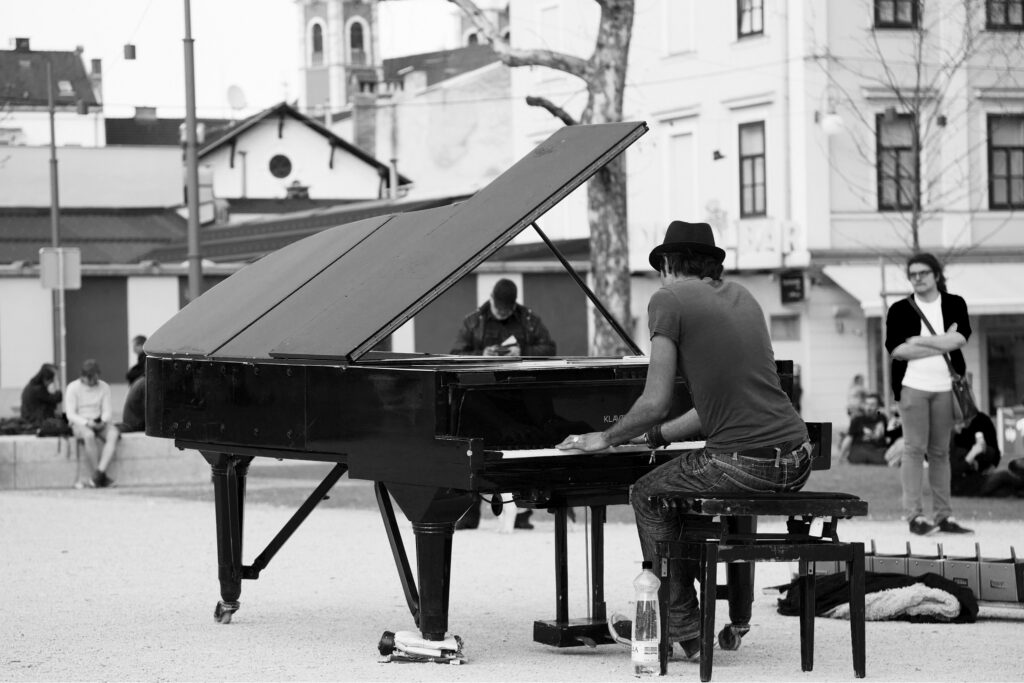 Davide Martello, AKA Klavierkunst (piano art), plays his black grand piano in the park of Kongresni Trg, Ljubljana, Slovenia. Davide is currently travelling the world on a mission to play his grand piano in every capital city in the world. On Tuesday April 16th he played here in Ljubljana. Check out more about Davide on his website: http://www.klavierkunst.com/