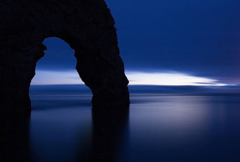 Close up of Durdle Door as the last wisp of light disappears over the horizon at dusk, Dorset, England. Durdle door is one of the many stunning locations to visit on the Jurassic coast in southern England.