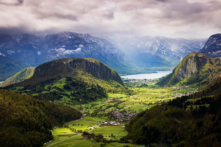 View down to Srednja Vas Lake Bohinj and the hills of Studor and Rudnica in the Bohinj Valley from Vodnik viewpoint, Triglav National Park, Slovenia.