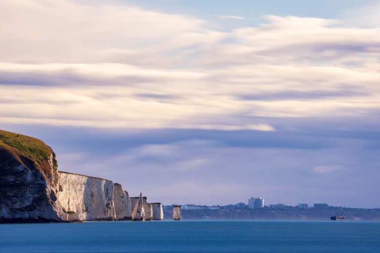 Morning view of the Old Harry Cliffs from Swanage beach, Dorset, England.