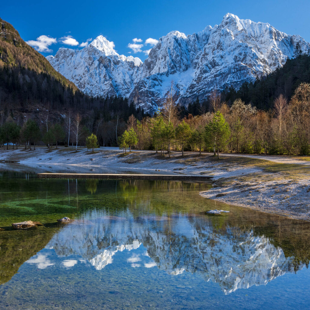 View across to the Julian Alps seen across Lake Jasna, near Kranjska Gora, Slovenia