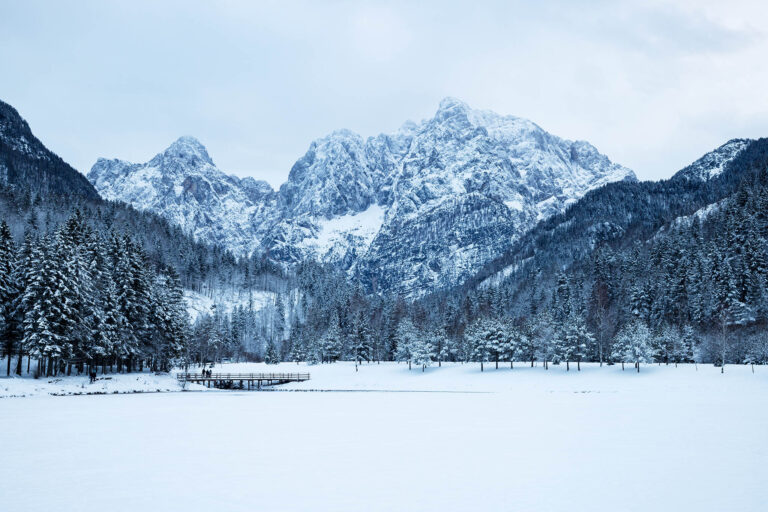 The Julian Alps seen across Lake Jasna in winter, near Kranjska Gora, Slovenia