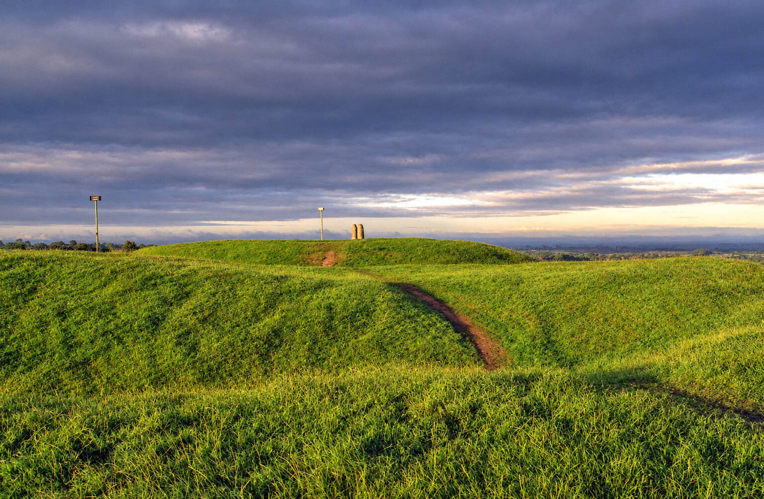 Iron age rath at the Hill of Tara in County Meath, Ireland. Tara was once the ancient capital of Ireland, from where the high king ruled over the country. The upright stone you see on the mound is the Lia Fail (stone of destiny). According to Celtic legend the Lia Fail was used during the coronation of the high king, and was believe to emit a roar when the true high king touched it. It was also the place where Samhain was celebrated.